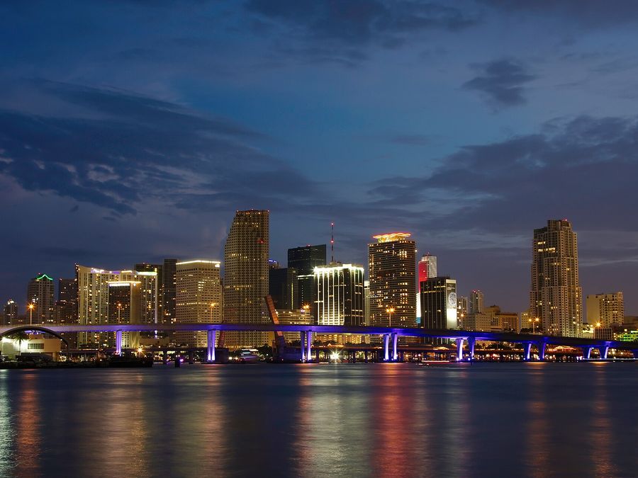 Downtown Miami skyline at dusk over the water