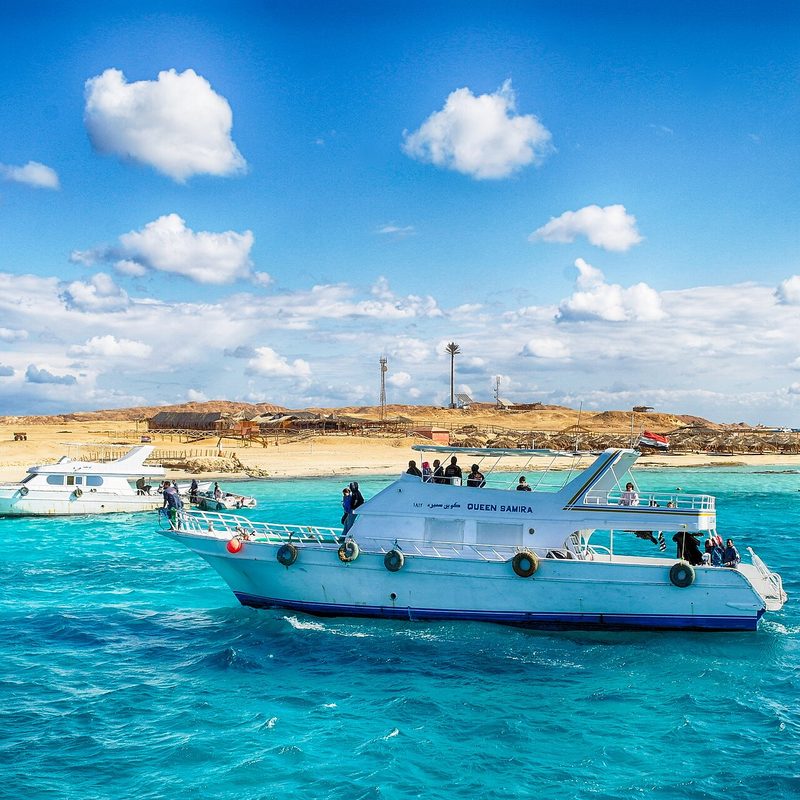 Day boat on turquoise water off Paradise (Giftun) Island, Red Sea